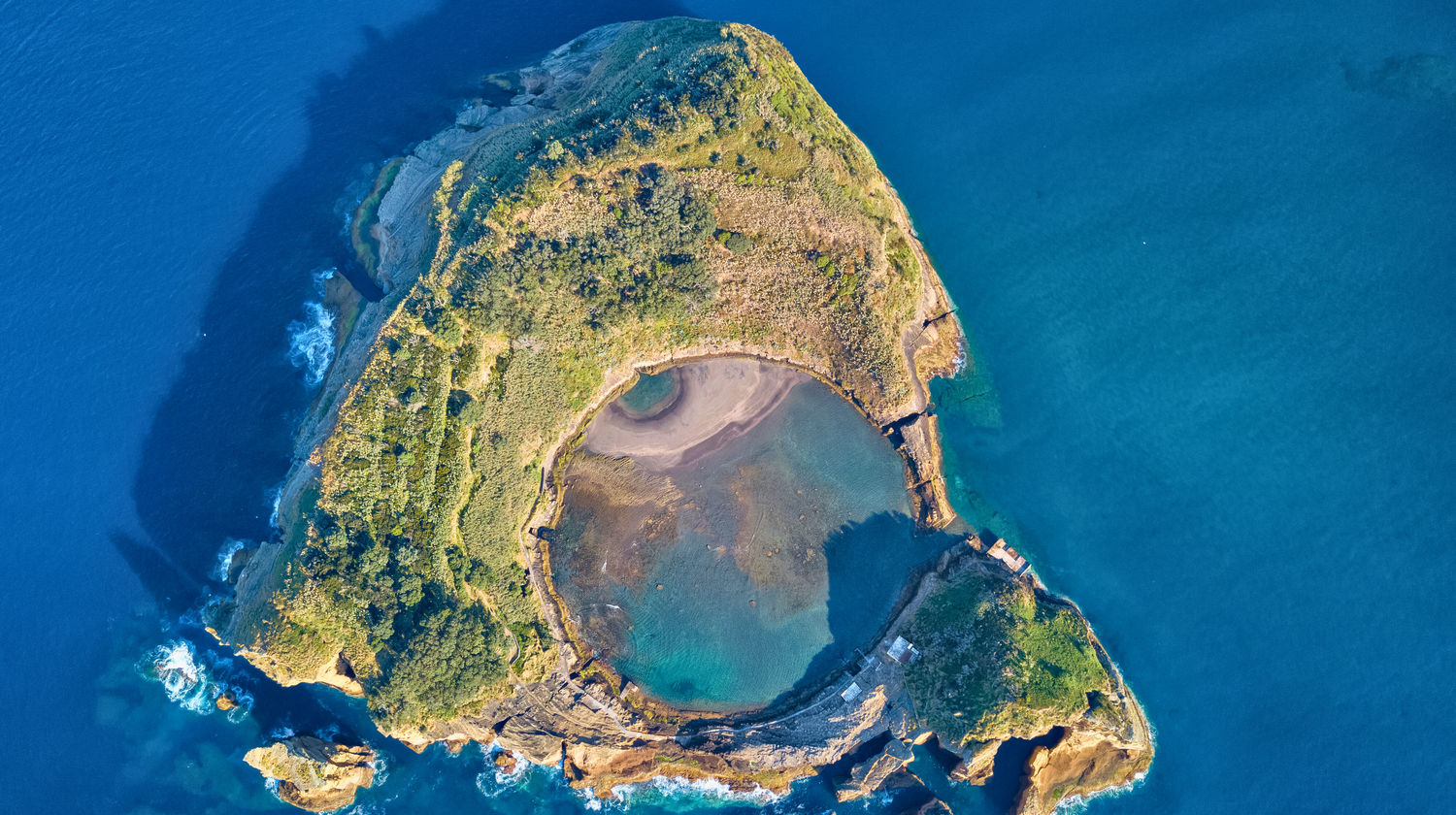 Aerial view of Ilhéu de Vila Franca do Campo surrounded by turquoise waters in São Miguel, Azores