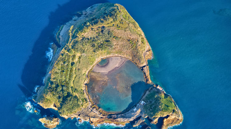 Aerial view of Ilhéu de Vila Franca do Campo surrounded by turquoise waters in São Miguel, Azores