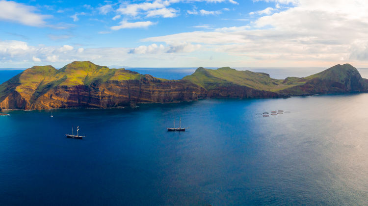 Coastal scenery of OPonta de São Lourenço in Madeira Island, with rocky shorelines, blue ocean and mountain backdrops.