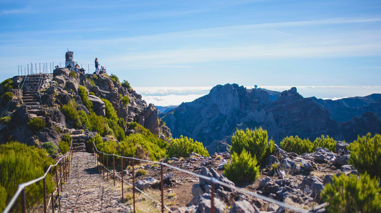 Scenic hiking trail at Pico do Areeiro with dramatic mountain peaks and panoramic views in Madeira Island