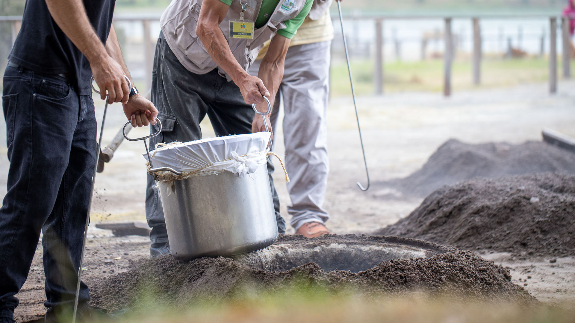 Preparing the traditional Furnas Cozido in volcanic soil