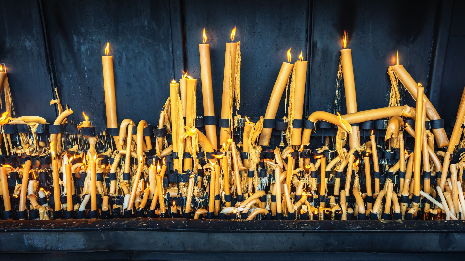 Candles offered at the Sanctuary of Fátima, a symbol of faith and devotion.