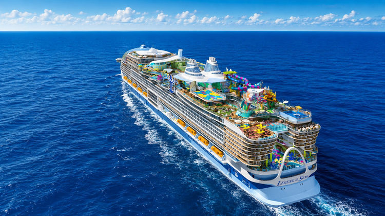 Aerial view of Royal Caribbean's Legend of the Seas cruise ship sailing across the Mediterranean Sea. The vessel features multiple decks, pools, water attractions, and entertainment areas designed for family cruising.