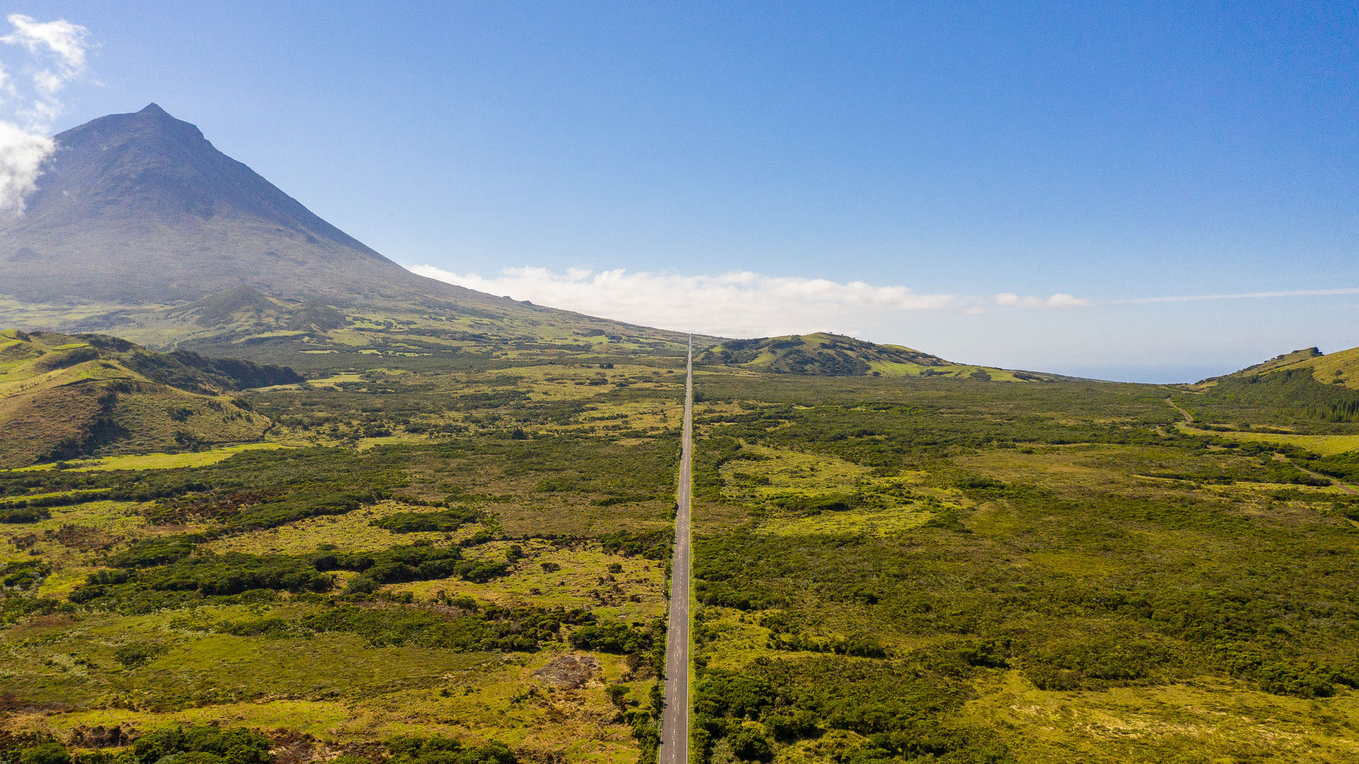 Scenic road to Mount Pico cutting through Pico Island’s countryside