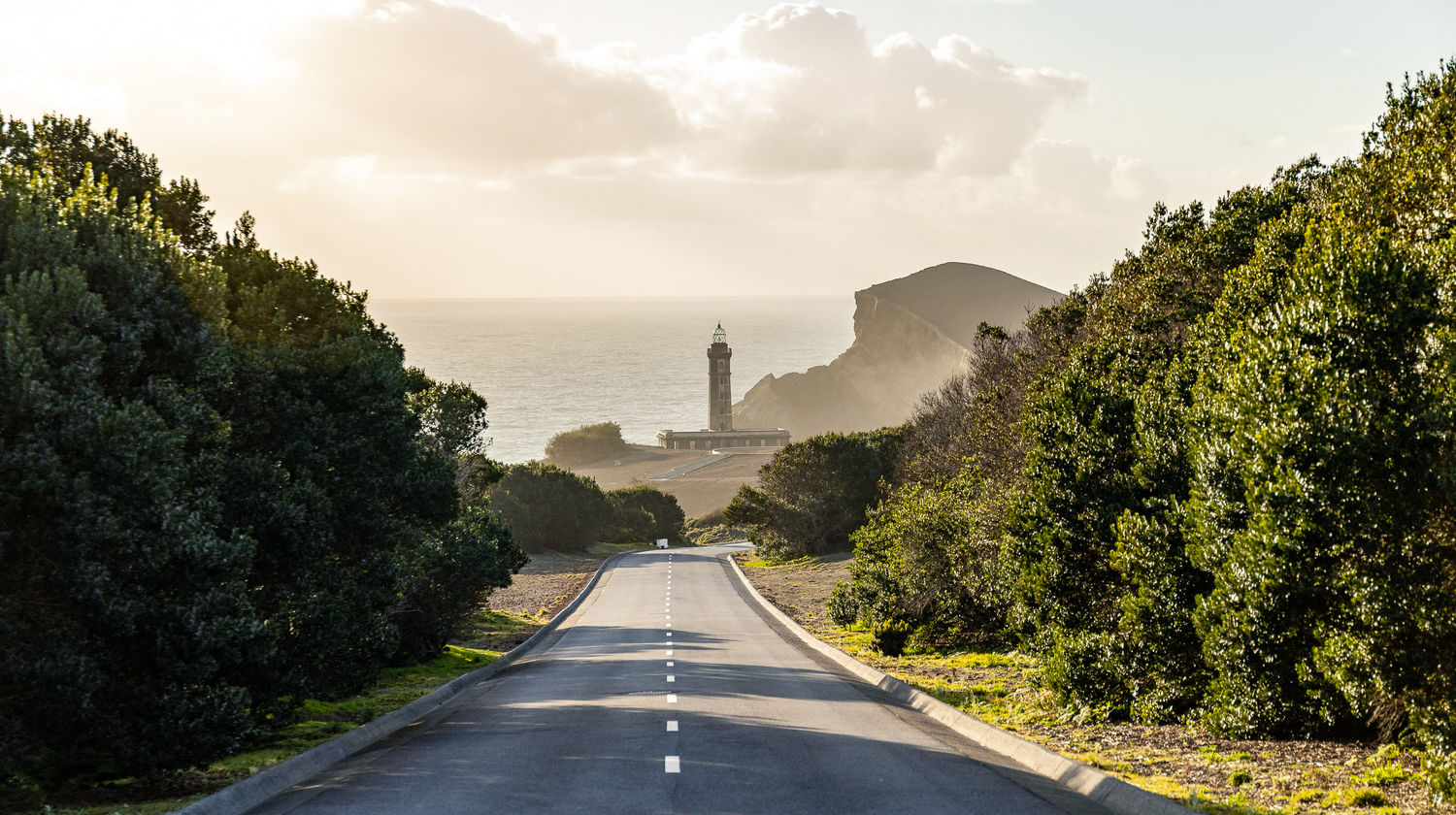 Scenic road leading to Capelinhos Volcano at sunset on Faial Island, Azores