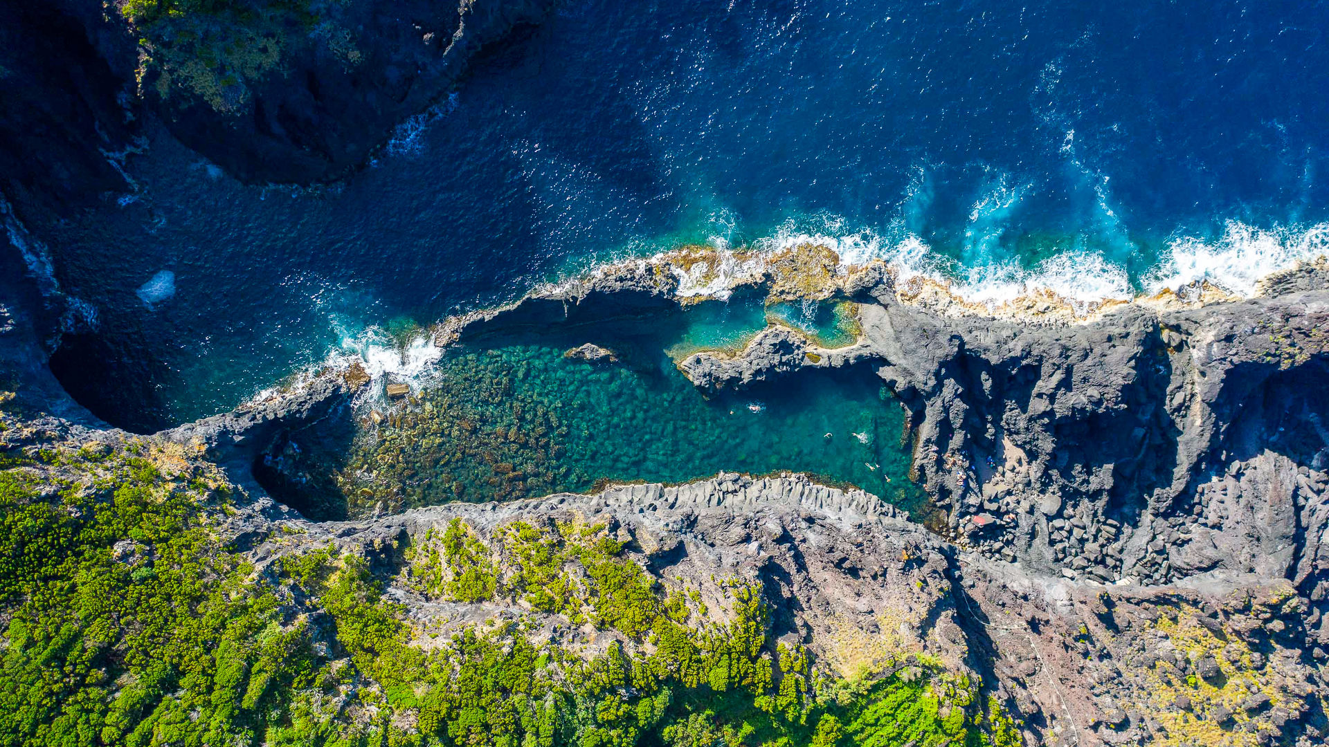 Crystal-clear natural pools at Poça de Simão Dias, São Jorge