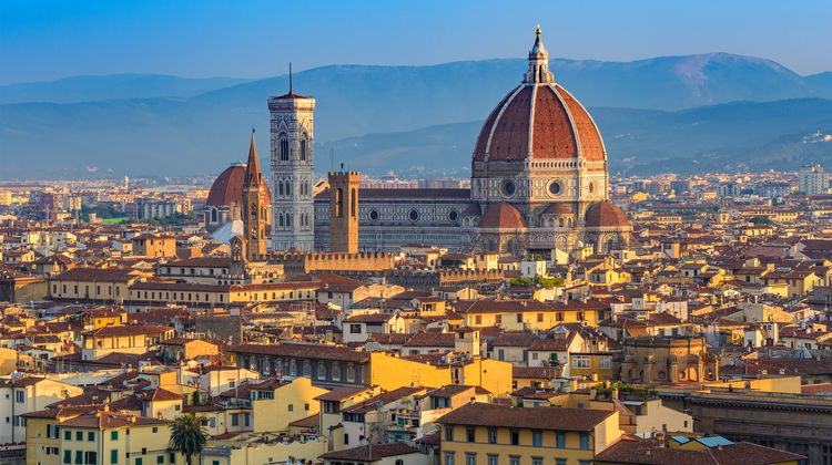 Panoramic view of Florence, Italy, with the dome of Florence Cathedral and Giotto’s Bell Tower rising above the historic city center.