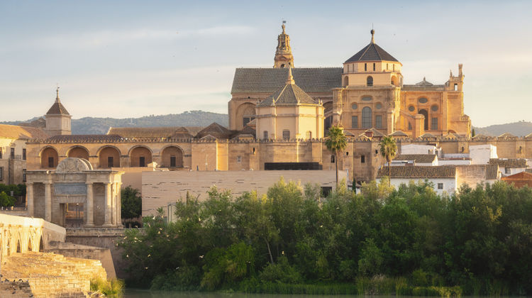 Córdoba Cathedral and Guadalquivir River – A Majestic View