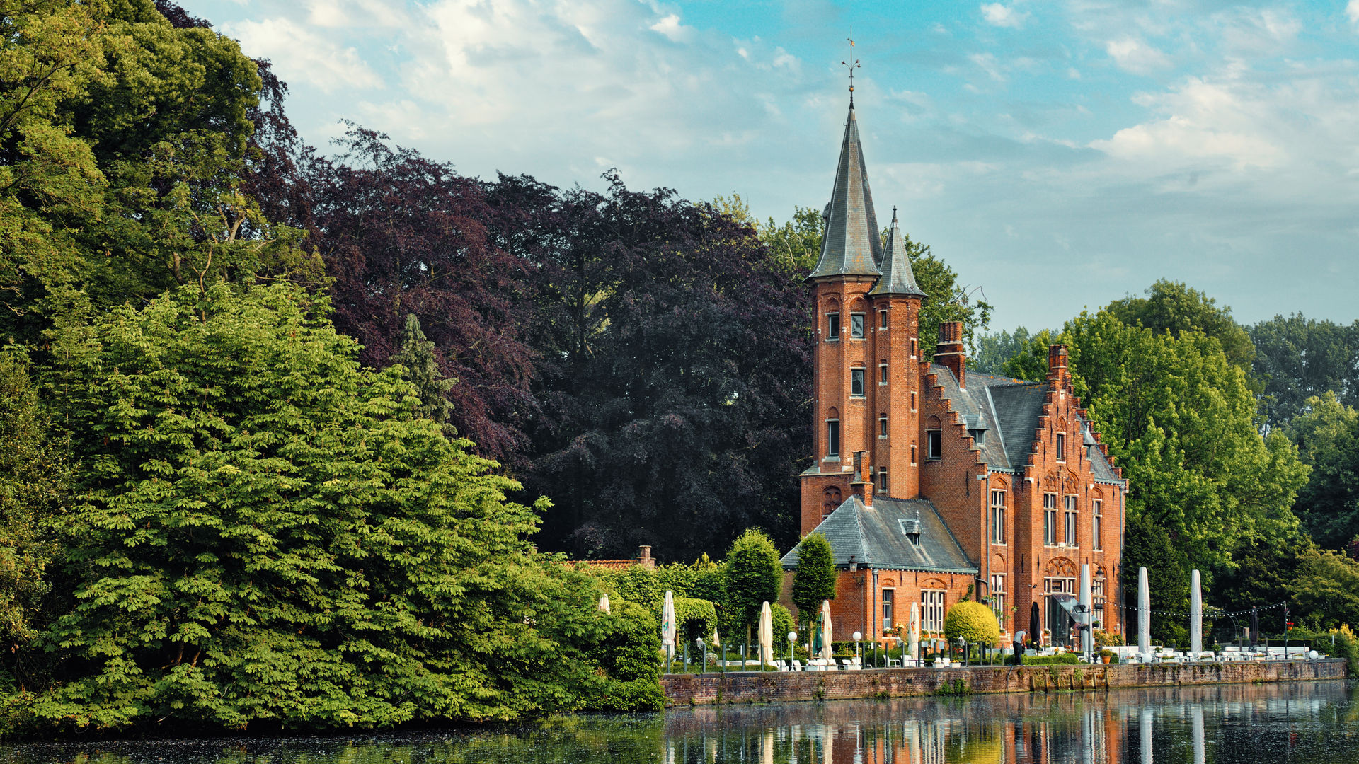Gothic restaurant Kasteel Minnewater on Lake Minnewater in Bruges, Belgium