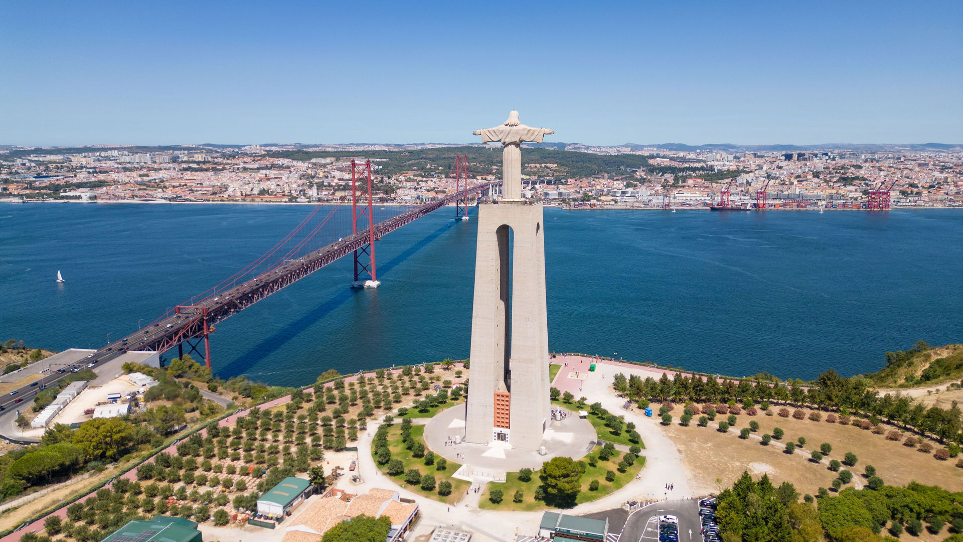 Sanctuary of Christ the King (Santuário de Cristo Rei) and the 25 de Abril Bridge in the Lisbon