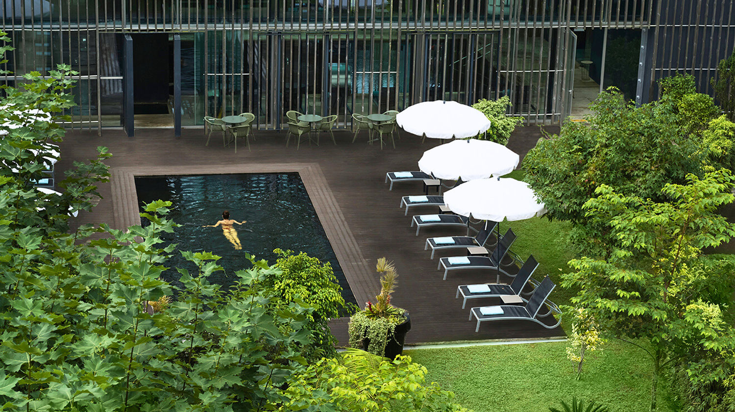 Modern outdoor pool surrounded by nature at Octant Furnas, 5-star hotel in São Miguel