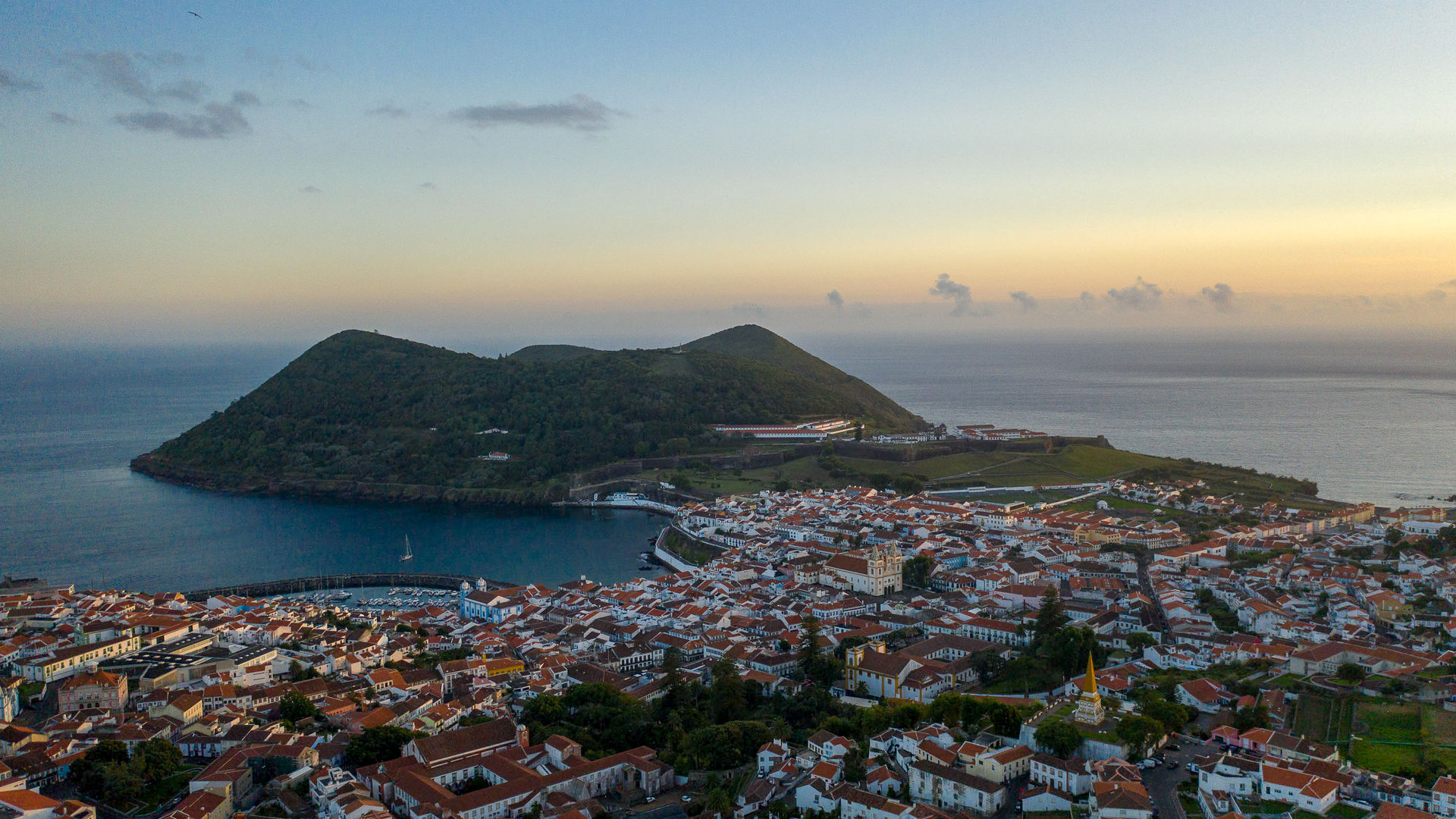 Caption: Sunset over Angra do Heroísmo and Monte Brasil, Terceira Island