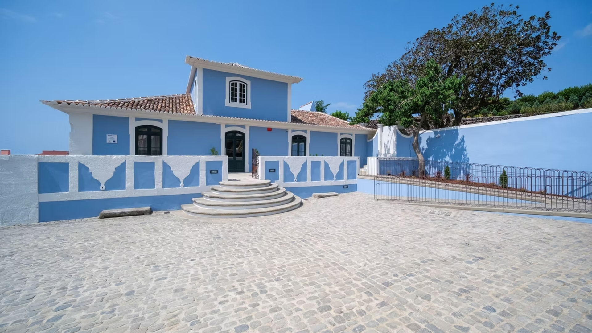 The charming blue and white facade of Azores Book Hotel