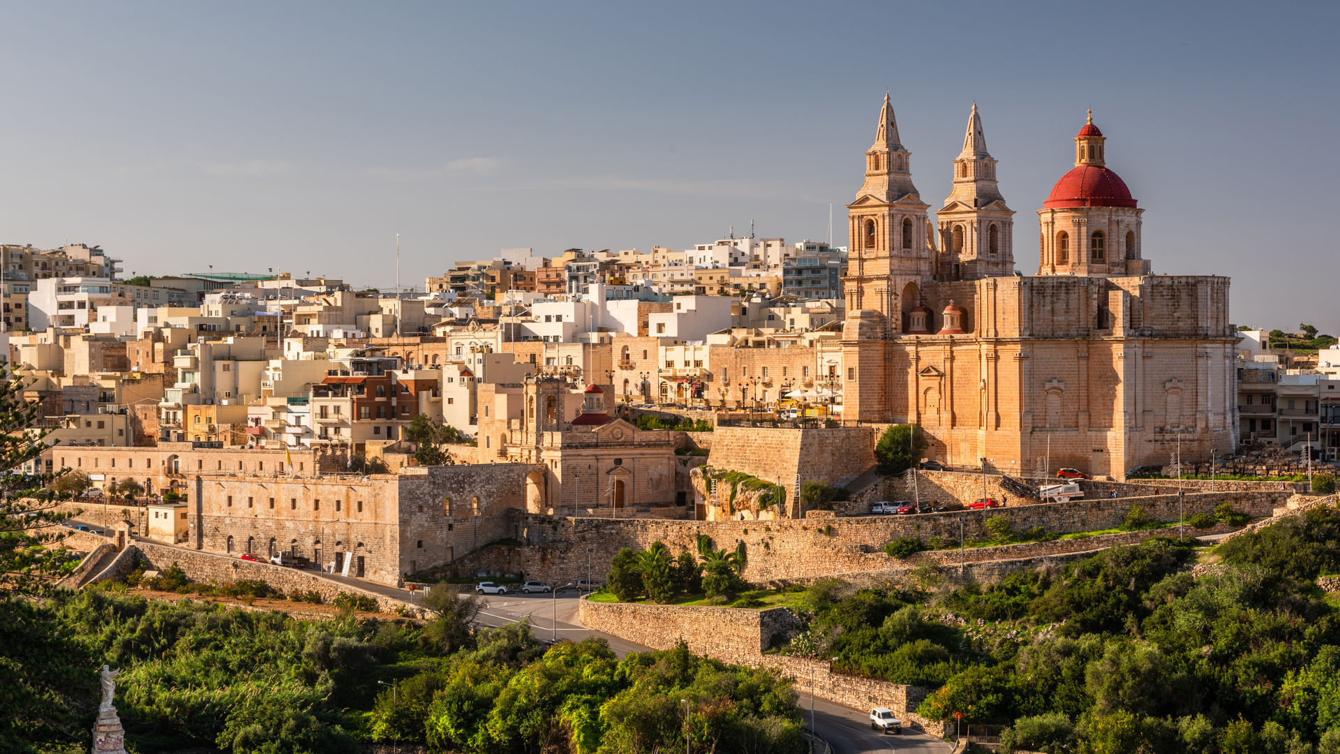 Mellieha Town at sunny day with Paris Church on Hill Top, Malta