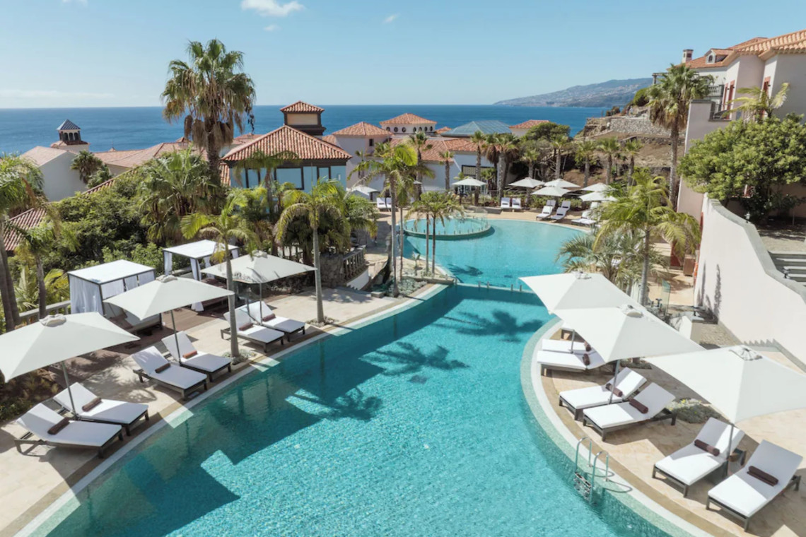 Pool with ocean views at Dreams Madeira Resort Spa & Marina, a top all-inclusive resort in Machico, Madeira.