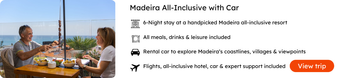 Madeira All-Inclusive Package with Flights, Hotel & Rental Car Couple enjoying a meal with ocean views in Madeira, promoting an all-inclusive resort package with flights, hotel, and rental car included.
