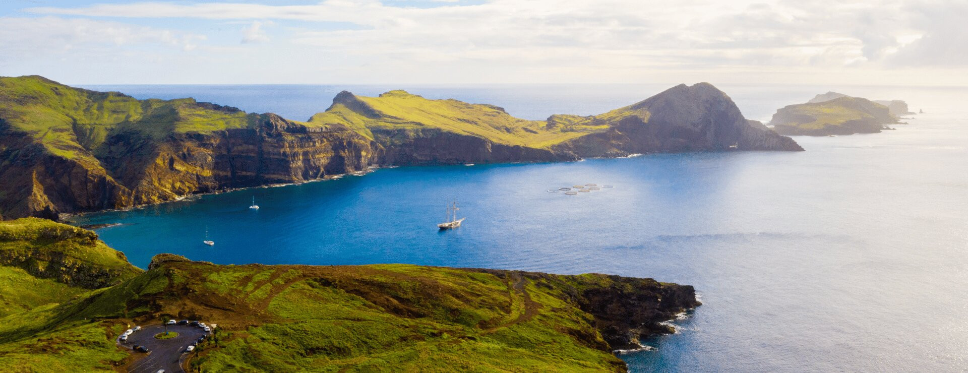 Aerial view of the Ponta de São Lourenço peninsula on Madeira, with dramatic volcanic cliffs, a narrow rocky cape and deep blue Atlantic on both sides