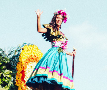 A performer in traditional costume takes part in the Madeira Flower Festival in Funchal, Madeira Island, Portugal. The image shows one of Madeira’s annual cultural celebrations, known for floral decorations, costumes, and street parades.