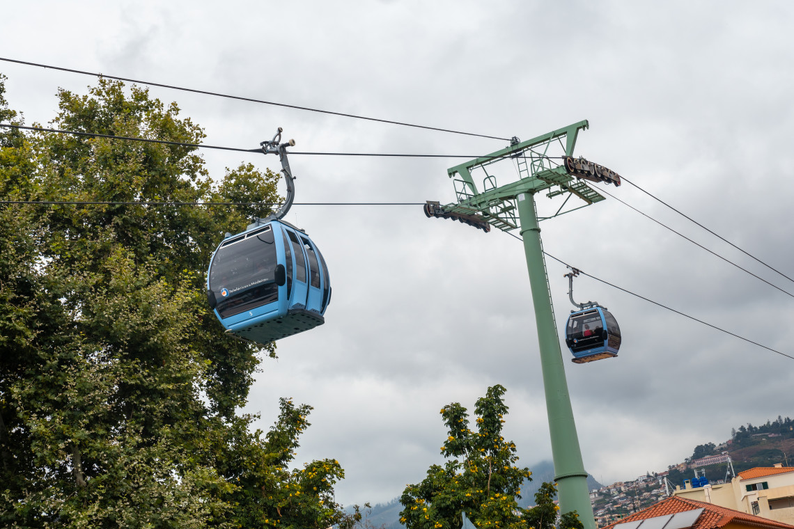 Blue cable car gondolas suspended on the Funchal to Monte cable car line in Madeira