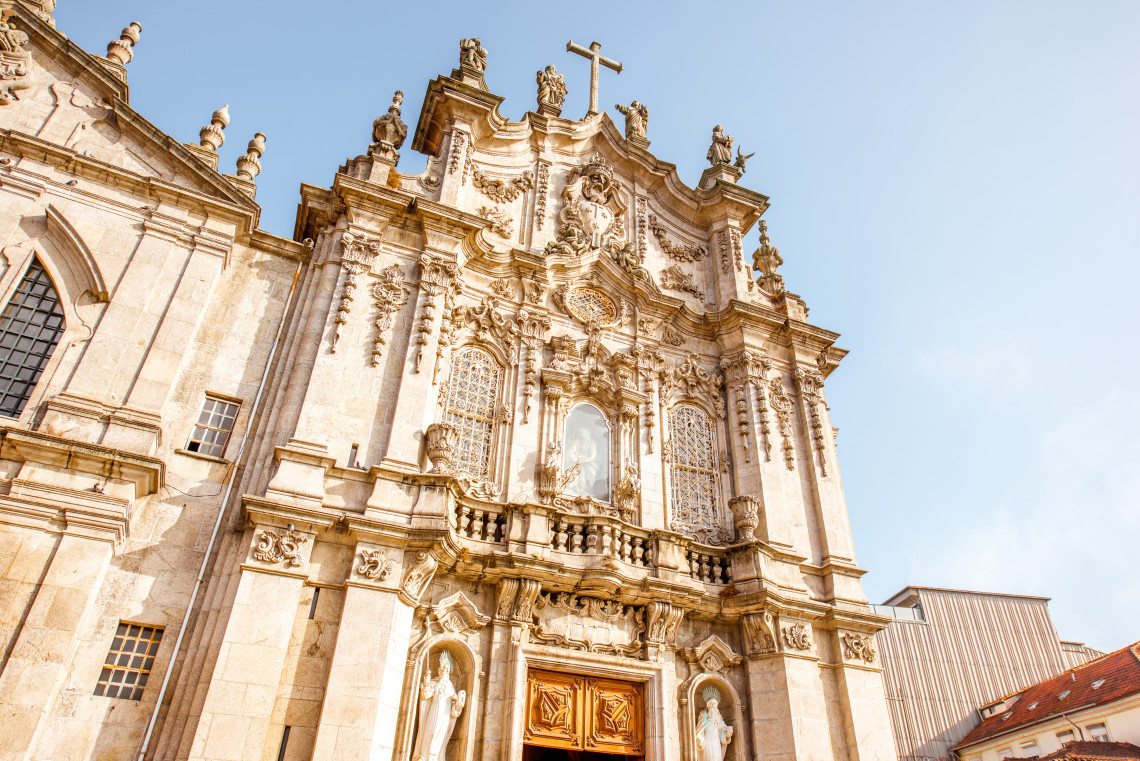 Exterior view of Igreja do Carmo in Porto, Portugal, showing its detailed baroque facade, sculptural decorations, and stone architecture. The church is one of Porto&rsquo;s notable historic landmarks.