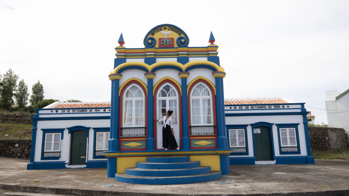 Colorful blue, yellow and red fa&ccedil;ade of the Imp&eacute;rio da Caridade in Praia da Vit&oacute;ria, a traditional Holy Spirit chapel on Terceira Island.