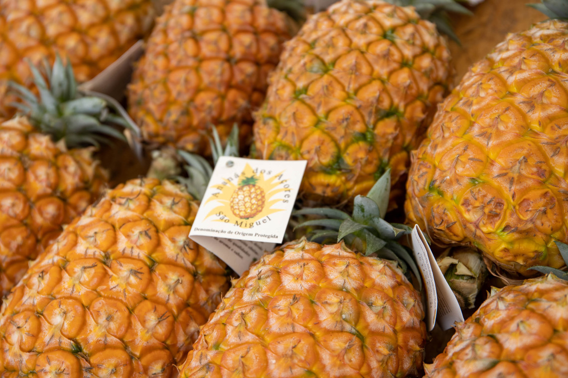 Close-up of locally grown Azorean pineapples, displaying the Anan&aacute;s dos A&ccedil;ores protected designation associated with S&atilde;o Miguel Island.