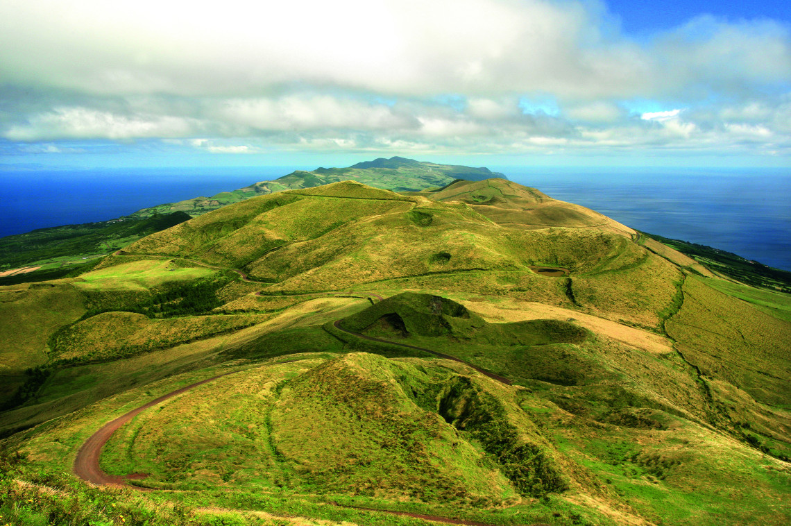 Rolling volcanic peaks and grass-covered ridges around Pico da Esperan&ccedil;a, the mountainous central landscape of S&atilde;o Jorge Island in the Azores.