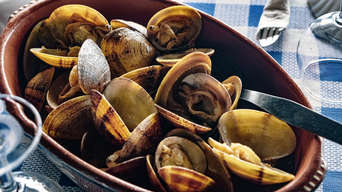 Bowl of cooked clams associated with Faj&atilde; da Caldeira de Santo Cristo on S&atilde;o Jorge Island, where the shellfish are cultivated in the coastal lagoon.
