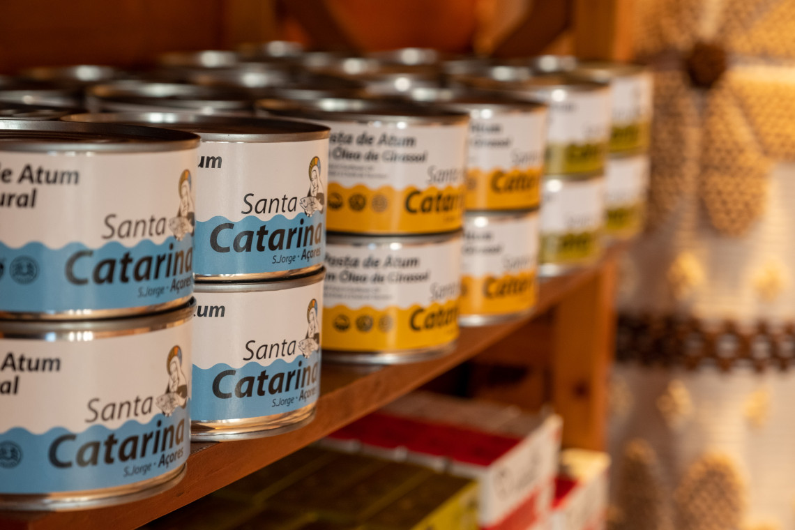 Cans of Santa Catarina tuna displayed on a shop shelf in S&atilde;o Jorge, representing the island&rsquo;s established tuna-processing tradition.