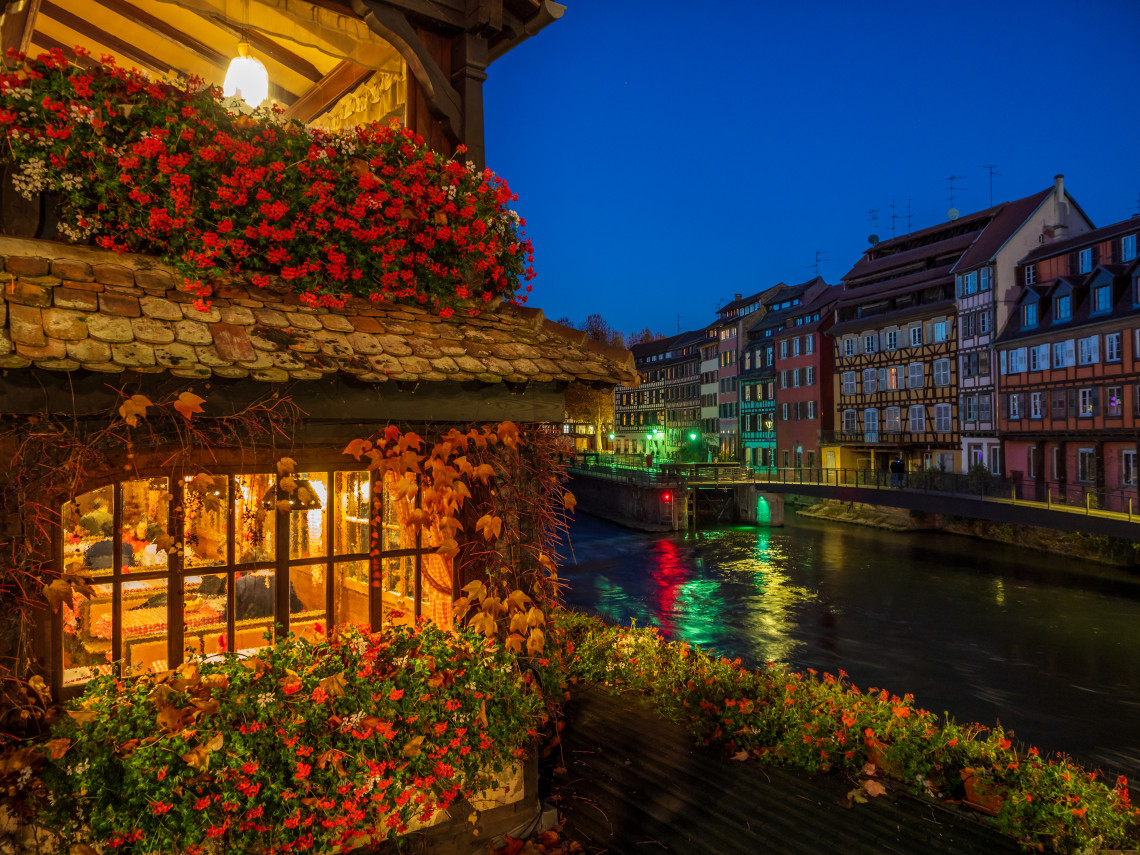 Petite France quarter in Strasbourg with half-timbered houses reflected in the canal at dusk, Alsace, France