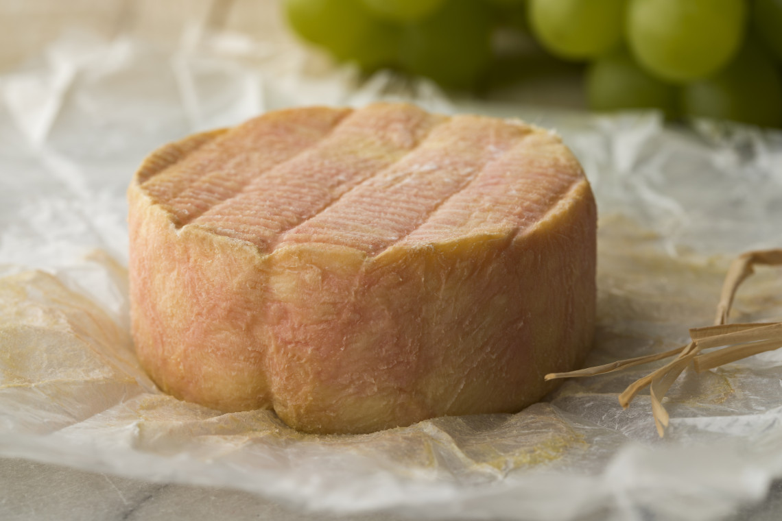 Traditional French muscat marc cheese on a wooden board, representing Lyon's gastronomy culture, France