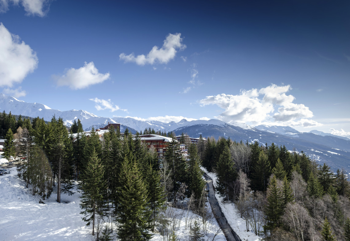 Ski resort of Les Arcs with snowy Alpine peaks and ski runs in the French Alps, France