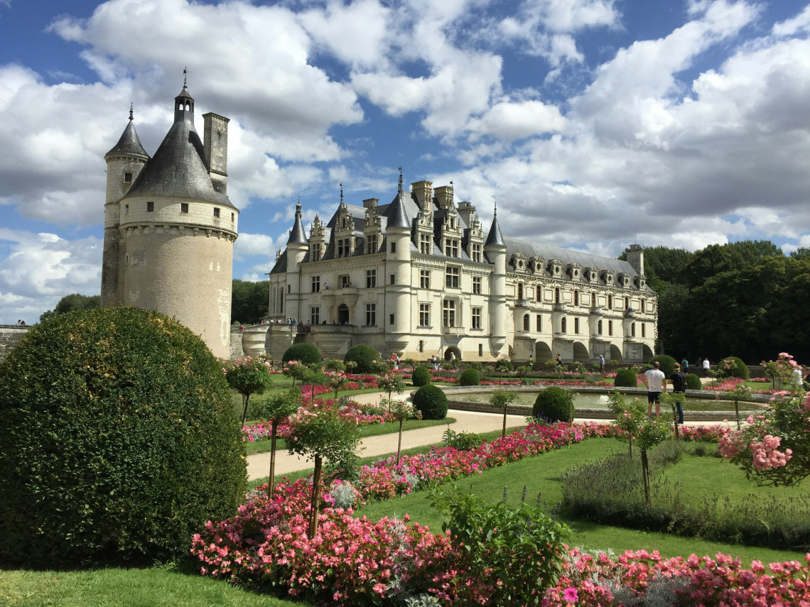  Chateau de Chenonceau with its cylindrical medieval tower and Renaissance facade surrounded by rose gardens in the Loire Valley France