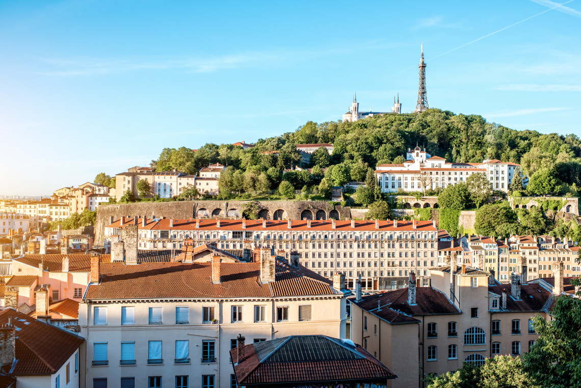 Panoramic view of Lyon rooftops with the Basilica of Notre-Dame de Fourviere on the hill and television tower, France