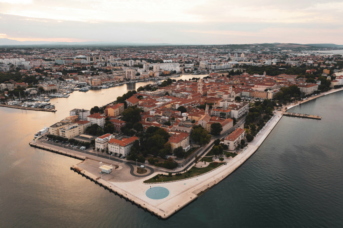 Aerial view of Zadar&rsquo;s historic centre in Croatia, occupying a peninsula bordered by the Adriatic Sea, marinas and waterfront promenades.